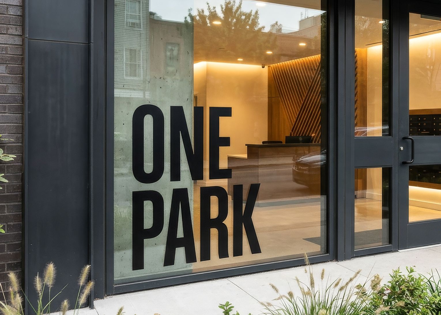 Cut vinyl building name applied to the lobby glass of a residential development