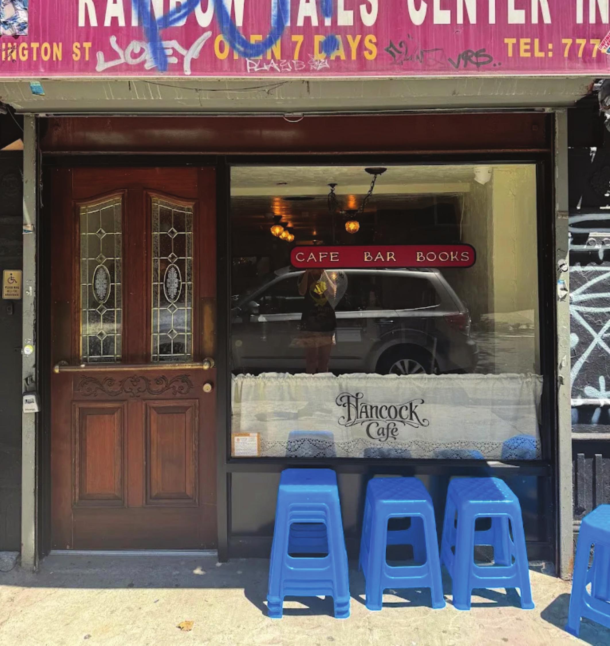 Hancock Cafe storefront window with cut vinyl signage for cafe, bar and books